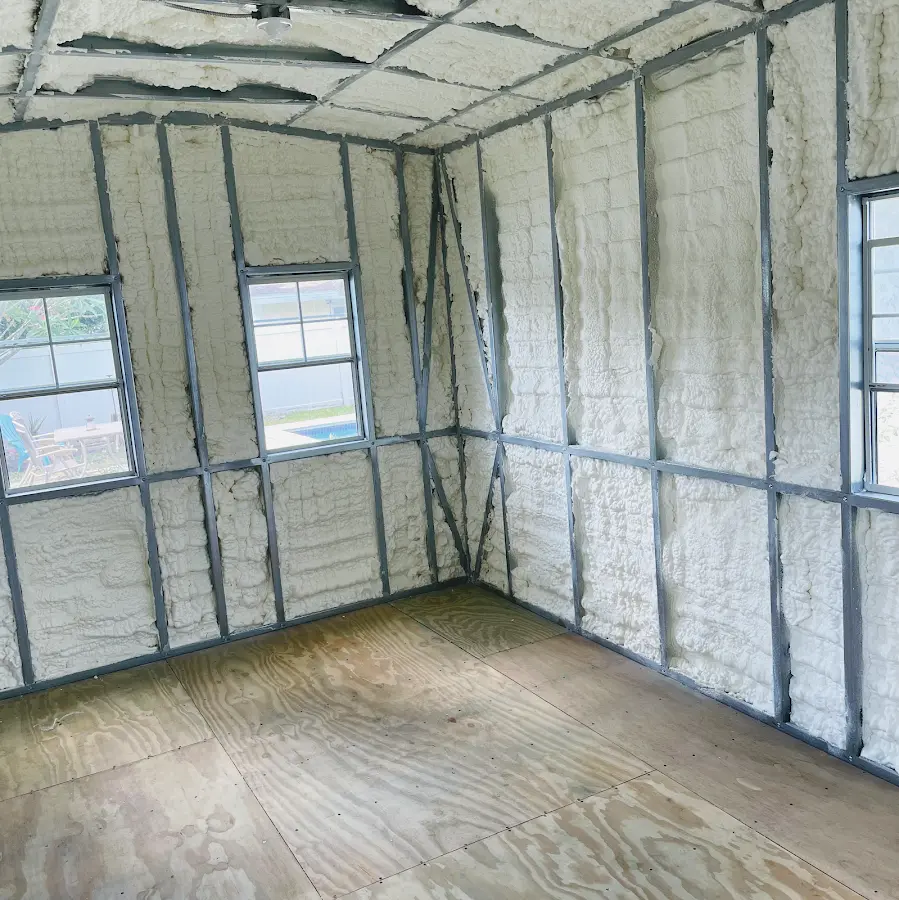 Closed-cell spray foam insulation applied to wall cavities in a residential project in Chesapeake Beach